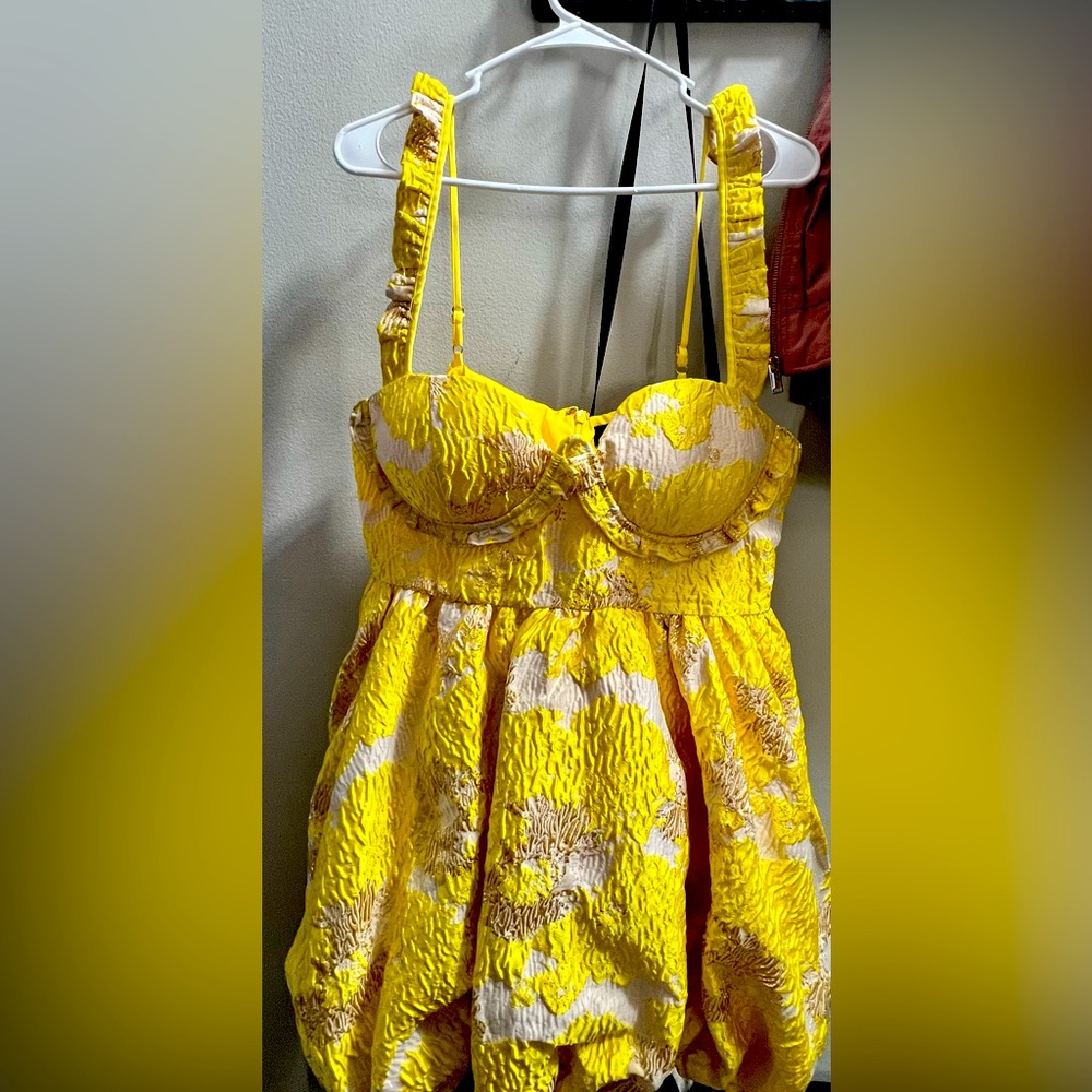 Yellow baby doll brocade dress. I'm a 42DD, so the dress is a smaller XL